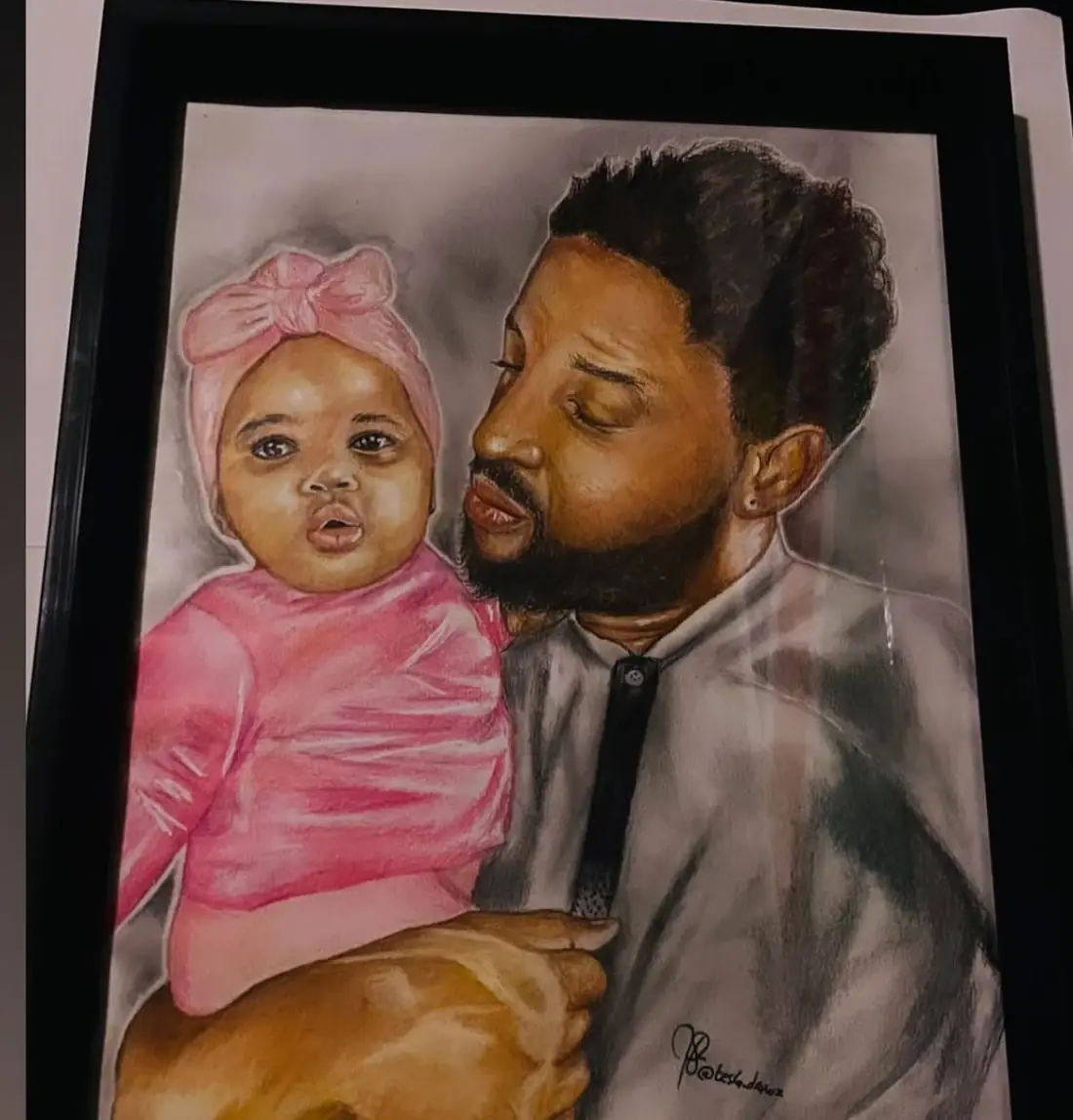 Coloured-pencil double portrait of an adult holding a baby dressed in pink.