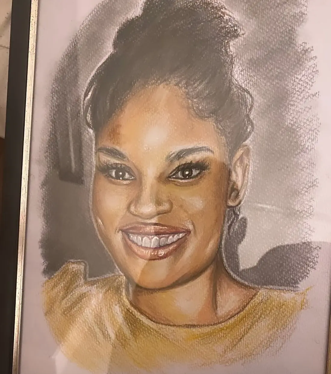 Coloured-pencil portrait of a smiling woman with an updo and warm-toned top.